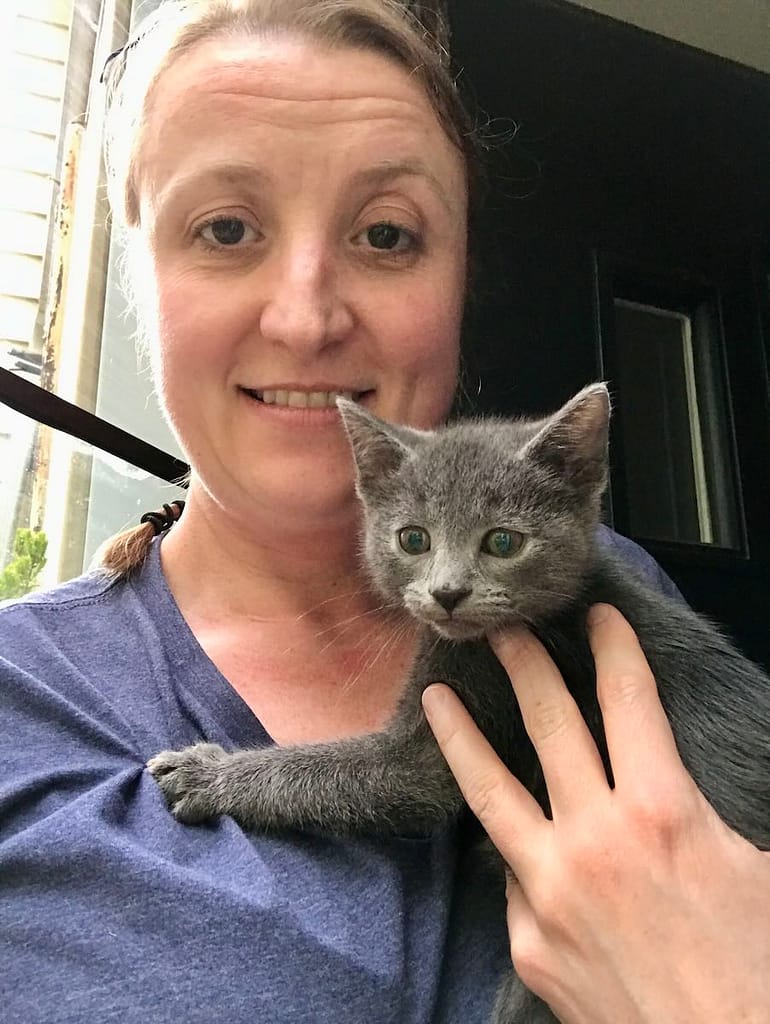 Hillary holding a grey kitten